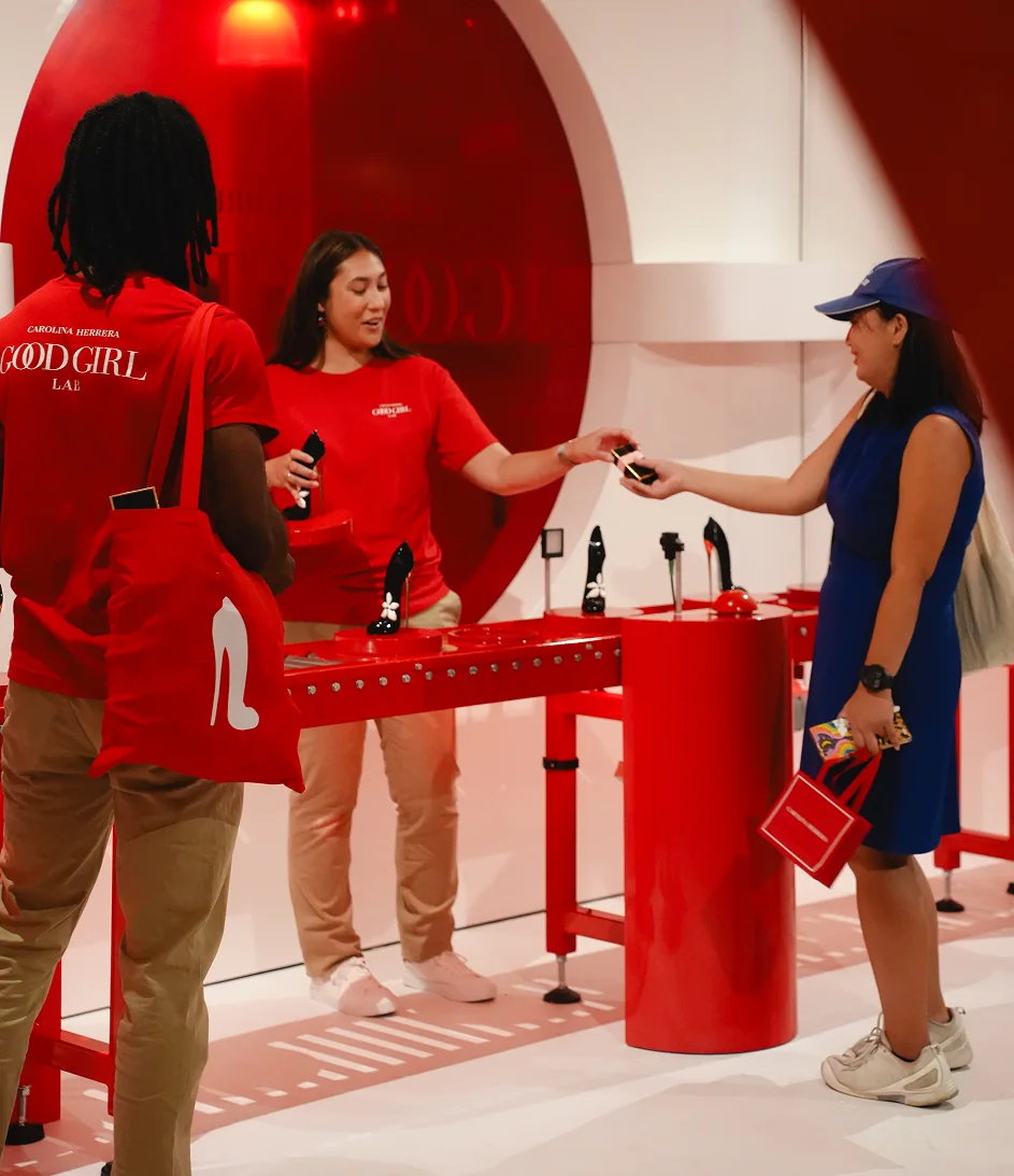 Guests interacting with the Good Girl Lab activation in SoHo
